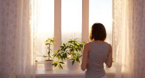 girl looking out window