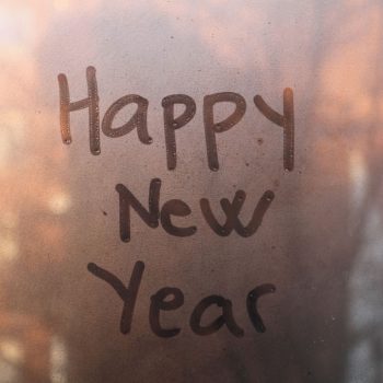 happy new year written on window